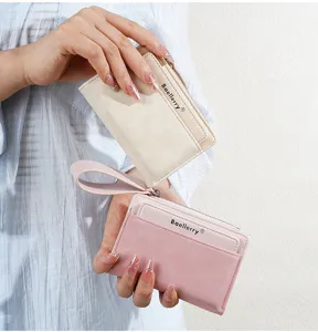 Detail shot showing the compact design, card slots, and zipper coin pocket of the mini wallet.