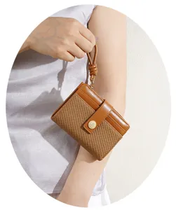Brown woven short wallet with wrist strap detail, compact card holder purse for daily use