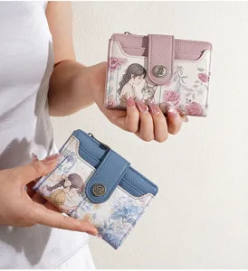 Detail view of women short wallet with retro cartoon print, multi-card slots and coin purse.