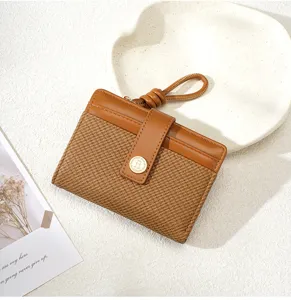 Stylish women's bifold short wallet with card slots and zipper pocket for daily use.