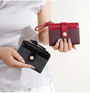 Women's short bicolor wallet with multiple card slots and secure zipper closure.