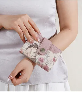 Short women's wallet with cute cartoon girl cat print and floral design, stylish pink folding purse.