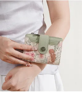 Detailed view of women's short wallet, floral pattern, card slots, zipper coin pocket.