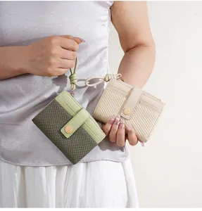 Women short woven wallet with card slots, coin purse and wrist strap. Compact stylish design.