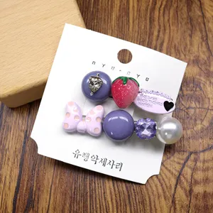 Sweet Korean style cute hair clips set with strawberry and bow rhinestones for women detail view