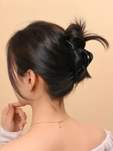 Minimalist black hair claw clip for women, chic geometric hairpin for daily updos and styling.