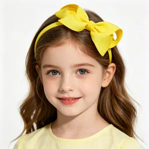Close-up detail of a bright yellow ribbon bow headband for cute kids hair styling accessories.