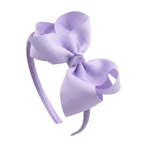 Detailed close-up view of the light purple 4-inch ribbon bow headband, showing soft fabric texture.