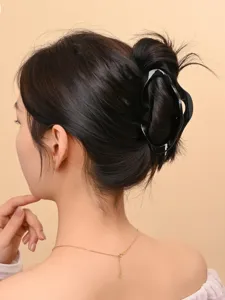 Black hair claw clip for women, chic hollow design shark clip, elegant bun hair accessories.