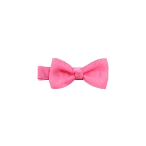 Detail view of the cute pink grosgrain ribbon hair bow clip for baby girls and kids.