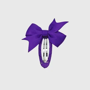 Purple bow hair clip for girls, cute fabric wrapped snap hair accessory for daily styling use.
