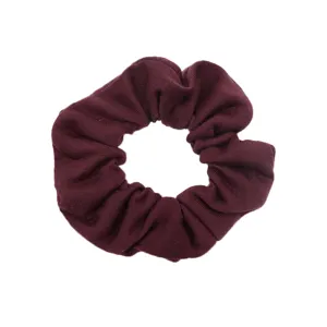 Gommino per capelli in tessuto bordeaux dettaglio, accessorio morbido per uso quotidiano.