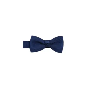 Detailed shot of dark blue grosgrain ribbon hair bow clip, solid color children hair accessory.