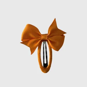 Orange ribbon bow hair clip detail, sweet pastoral style children daily hair accessory.
