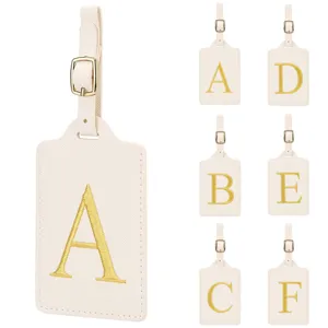 Étiquette de bagage voyage en cuir PU avec des lettres brodées dorées, durable et portable.