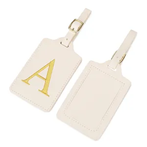 Étiquette de bagage brodée de lettres, porte-nom de valise beige avec lettre dorée A.