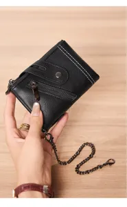 Close-up detail view of the black leather short wallet featuring sturdy metal zippers and chain.