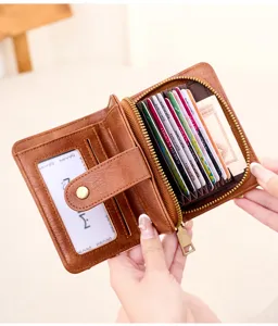 Vintage braunes Leder Damen Kurzgeldbörse mit Ziehharmonika-Kartenfächern und Reißverschluss.