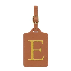 Étiquette de bagage en cuir PU marron avec lettre E dorée brodée pour valises de voyage.