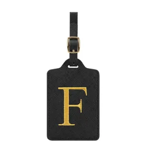 Schwarzes Gepäckschild aus PU-Leder mit goldener gestickter Buchstabe F und Schnalle.