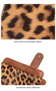 Nahaufnahme zeigt weiche Leopardenmuster Stofftextur und stabile Metall Druckknopf Details.