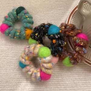 Cozy wool wrapped hair scrunchies with colorful felt balls, elastic winter hair accessories.