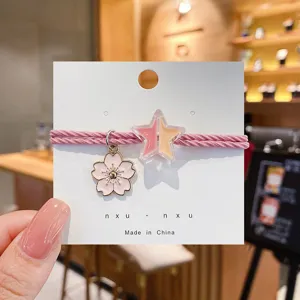 Schattig roze ster kersenbloesem haar elastiek en armband dubbel gebruik detail weergave