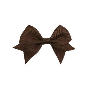 Detail view of the 6cm brown grosgrain ribbon hair bow, showing neat fabric texture and tail shape.