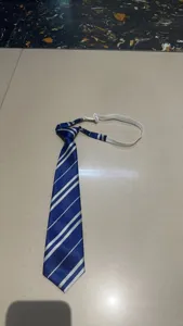 Detail view of the blue and white striped Japanese style JK/DK student tie with zipper design.