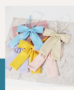 Detailed close-up shot of colorful Japanese JK uniform bow ties with adjustable neck straps.