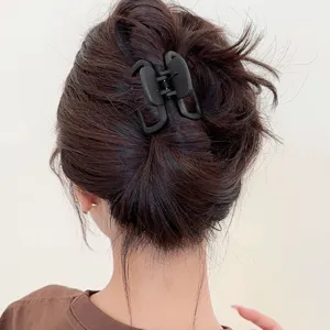 Matte black square hair claw clip, stylish geometric shark clip for elegant half-up hairstyles.