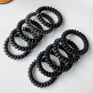 Black gradient telephone wire hair ties, highly elastic minimalist spiral hair bands for daily styling.