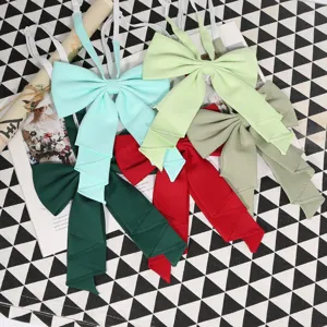 Detail shot of solid color big bow JK uniform bowtie in multiple colors, elegant and stylish.