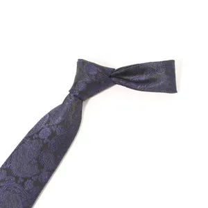 Elegant men business necktie featuring classic blue paisley pattern on dark fabric for formal wear.