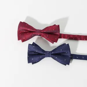 Detail view of classic men's formal bow ties in red and blue, featuring elegant dot patterns.