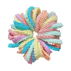 Detailed view of colorful seamless hair ties for kids, vibrant macaroon colors assortment.