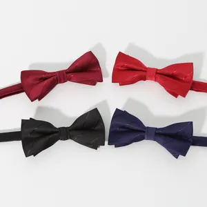 Detail view of classic silk bowties in assorted colors, perfect for formal business wear.