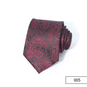 Detail view of mens business necktie with classic red and black paisley pattern.