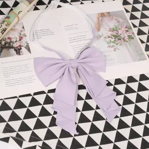 Detail close-up of a light purple bow tie for JK uniform with elastic strap.