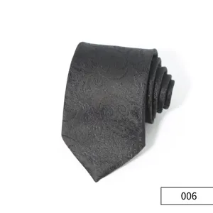 Detailed view of men's black business tie featuring classic retro paisley jacquard pattern, polyester.