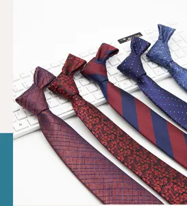 Men business necktie detail showing burgundy blue stripes and floral patterns for formal wear.