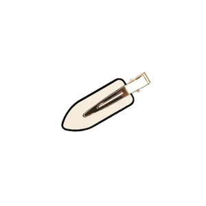 Minimalist geometric hairpin with elegant black border and gold duckbill clip for styling.