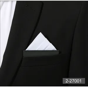 Close up detail of mens black suit jacket chest pocket with crisp white pocket square.