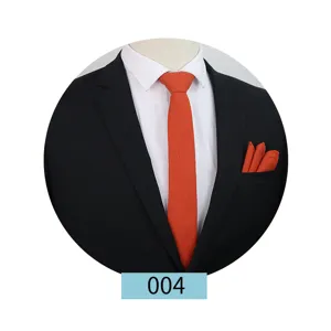 Orange solid color tie and pocket square set detail shot, ideal for business and wedding suits.