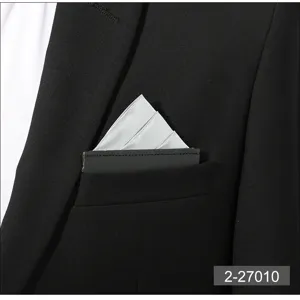 Close-up view of a sleek silver pocket square neatly inserted in a black suit pocket.