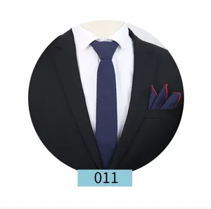 Detailed view of men's dark blue suit tie and pocket square with red trim for formal wear.