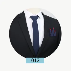 Men's solid color pocket square detail view in classic navy blue with red trim for business suit.