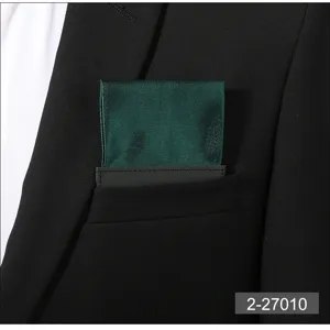 Men's dark green pre-folded pocket square suit accessory detail view for formal business wear.