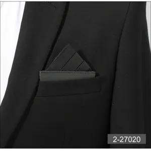 Detailed view of a black mens pocket square insert, elegant solid color suit accessory for formal wear.