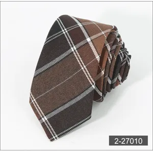 Detailed shot of a brown plaid tie, elegant men's accessory with neat texture and roll design.